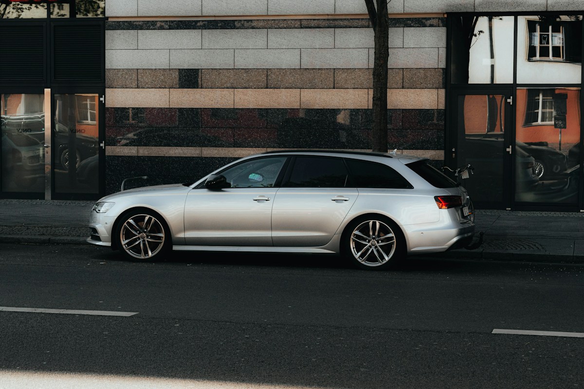 Illustrative photograph of a silver estate car on a street
